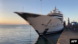 FILE - This handout photo courtesy of the U.S. Department of Justice released on May 5, 2022 shows the Amadea yacht owned by sanctioned Russian oligarch Suleiman Kerimov docked in Lautoka, Fiji. (U.S. Department of Justice via AFP)