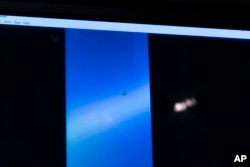 A video of a UAP is paused for display during a hearing on "Unidentified Aerial Phenomena," on Capitol Hill, May 17, 2022, in Washington, DC. (AP Photo/Alex Brandon)