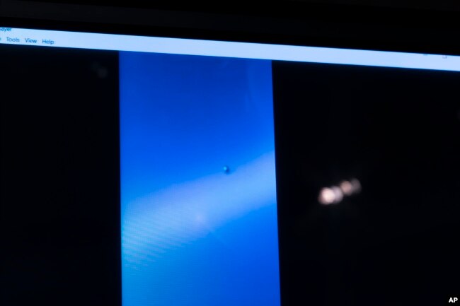 A video of a UAP is paused for display during a hearing on "Unidentified Aerial Phenomena," on Capitol Hill, May 17, 2022, in Washington, DC. (AP Photo/Alex Brandon)