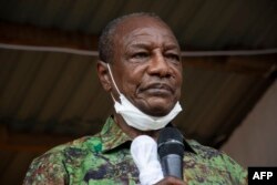 FILE - Guinea President Alpha Conde addresses his supporters during a campaign rally in Kissidougou, Oct. 12, 2020.