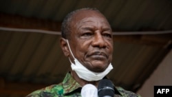 FILE - Guinea President Alpha Conde addresses his supporters during a campaign rally in Kissidougou, Guinea, Oct. 12, 2020.