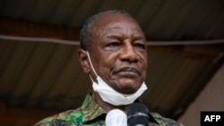 FILE - Then-President Alpha Conde addresses his supporters during a campaign rally in Kissidougou, Oct. 12, 2020.