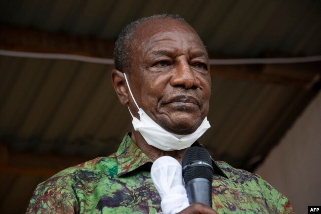 FILE - Guinea President Alpha Conde addresses his supporters during a campaign rally in Kissidougou, Oct. 12, 2020.