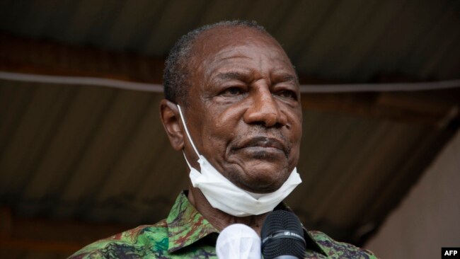 FILE - Then-President Alpha Conde addresses his supporters during a campaign rally in Kissidougou, Oct. 12, 2020.