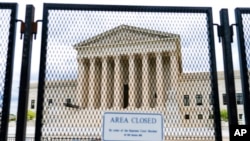 An anti-scaling fence surrounds the US Supreme Court on May 5, 2022, in Washington.