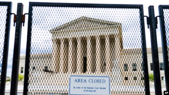 An anti-scaling fence surrounds the US Supreme Court on May 5, 2022, in Washington.