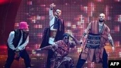 Members of the band "Kalush Orchestra" perform on behalf of Ukraine in the final of the Eurovision Song Contest 2022, May 14, 2022, in Turin.