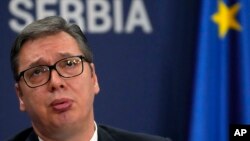 FILE- Serbian President Aleksandar Vucic reacts during a press conference in Belgrade, Serbia, Sept. 8, 2021. Vucic said he has secured an "extremely favorable" gas deal with Russia during his telephone conversation with President Vladimir Putin on Sunday