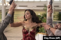 This image released by Warner Bros. Entertainment shows Gal Gadot in a scene from "Wonder Woman 1984." (Clay Enos/Warner Bros. Entertainment via AP)