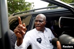 FILE - Martin Fayulu, runner-up in Democratic Republic of Congo's presidential election enters his car after delivering his appeal contesting the Congo's National Independent Electoral Commission results at the constitutional court in Kinshasa, Democratic