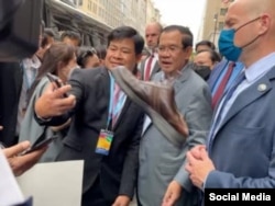 A protester threw a shoe aimed at Cambodia's Prime Minister Hun Sen, during his meet-and-greet with his supporters in Washington DC, Wednesday, May 11, 2022.