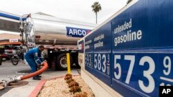 A gas tank driver delivers 8,500 gallons of gasoline at an ARCO gas station in Riverside, Calif., May 28, 2022. (