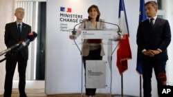 Sports Minister Amélie Oudéa-Castéra, center, speaks during a press conference with Paris police prefect Didier Lallement, left, and French Interior Minister Gerald Darmanin, May 30, 2022, in Paris. 