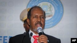 Hassan Sheikh Mohamud speaks after his election win at the Halane military camp in Mogadishu, Somalia, Sunday, May 15, 2022. (AP Photo/Farah Abdi Warsameh)