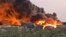 Une enquête a été ouverte pour déterminer les causes de cet incendie qui a entièrement recouvert de fumée le port, situé à près de 800 km au nord-est de Khartoum.