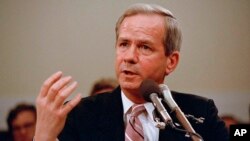 FILE - Former national security adviser Robert C. McFarlane gestures while testifying before the House-Senate panel investigating the Iran-Contra affair on Capitol Hill in Washington, May 13, 1987.