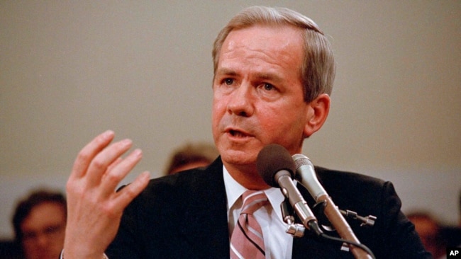 FILE - Former national security adviser Robert C. McFarlane gestures while testifying before the House-Senate panel investigating the Iran-Contra affair on Capitol Hill in Washington, May 13, 1987.
