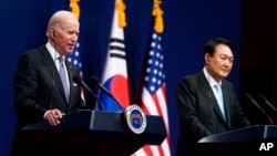 U.S. President Joe Biden, left, speaks as South Korean President Yoon Suk Yeol listens during a news conference at the People's House inside the Ministry of National Defense, May 21, 2022, in Seoul, South Korea.