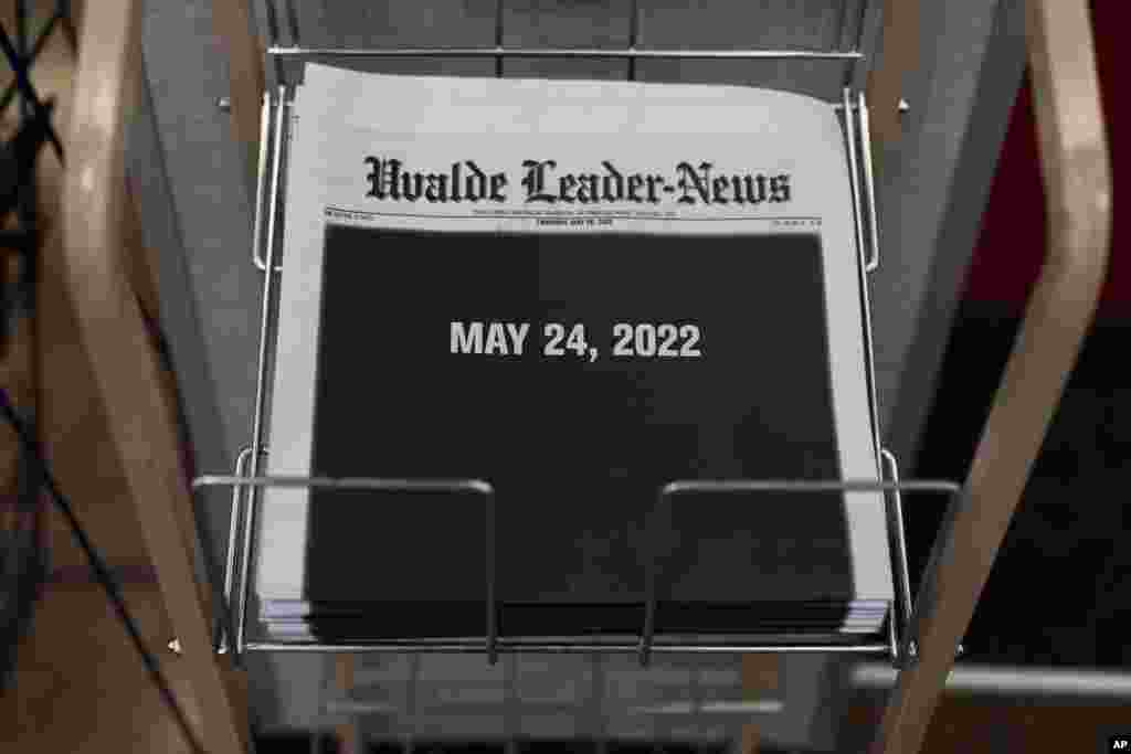 Copies of the Uvalde Leader-News with a black front page showing the date of the Robb Elementary School shooting are seen at a market in Uvalde, Texas.