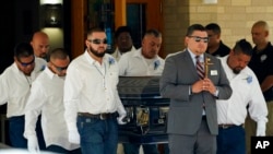 Pallbearers carry the coffin of Jose Flores Jr. after a funeral service at Sacred Heart Catholic Church on June 1, 2022 in Uvalde, Texas.  Flores was killed in a shooting at an elementary school last week.
