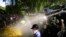 Police fire tear gas and water cannons to disperse protesting members of the Inter University Students Federation during an anti-government protest in Colombo, Sri Lanka, May 19, 2022.