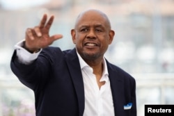 Forest Whitaker poses during a photocall before being awarded with an honorary Palme d'Or prize during the opening ceremony. (REUTERS/Sarah Meyssonnier)