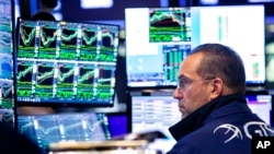 Specialist Anthony Matesic works on the trading floor, May 23, 2022, in this photo provided by the New York Stock Exchange.