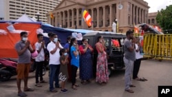 Protesters demanding Sri Lankan President Gotabaya Rajapaksa resign perform a religious observance to mark Buddha Poornima or Vesak at a protest site outside President's office in Colombo, Sri Lanka, May 15, 2022.