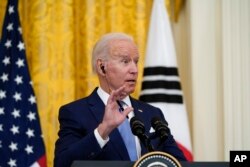 President Joe Biden speaks during a joint news conference with South Korean President Moon Jae-in, in the East Room of the White House, Friday, May 21, 2021, in Washington. (AP Photo/Alex Brandon)