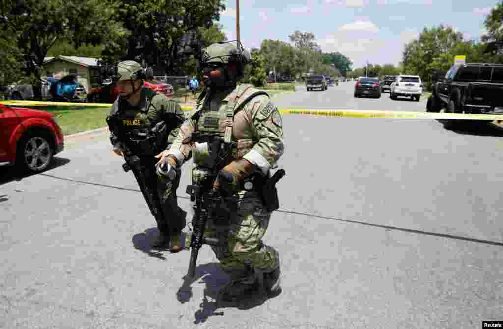 Law enforcement personnel near the scene of a suspected shooting near Robb Elementary School in Uvalde, Texas, May 24, 2022.