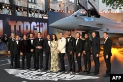 FILE - Members of the cast pose upon arrival for the U.K. premiere of the film "Top Gun: Maverick" in London, Britain, May 19, 2022.
