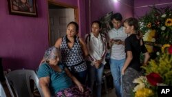 Relatives of slain journalist Yessenia Mollinedo Falconi attend her wake at the family's home in Minatitlan, Veracruz state, Mexico, May 10, 2022. 