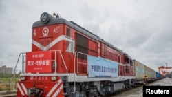 FILE - A train bound for Duisburg, Germany, carrying containers departs from Wuhan as China-Europe Railway Express service resumes in Wuhan, Hubei province, then the epicenter of China's COVID-19 outbreak, March 28, 2020.
