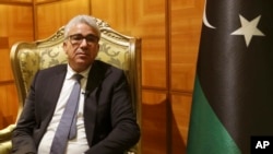 FILE - Fathi Bashagha, then Libya's UN-supported government's interior minister, sits during an interview Jan. 6, 2021 in Tripoli, Libya.