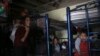 FILE - Migrants rest in a dormitory of the Good Samaritan shelter in Juarez, Mexico, March 29, 2022. 