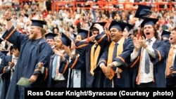 Students from the Syracuse University class of 2022 celebrate during their graduation ceremony in May. (Courtesy photo Ross Oscar Knight/Syracuse)