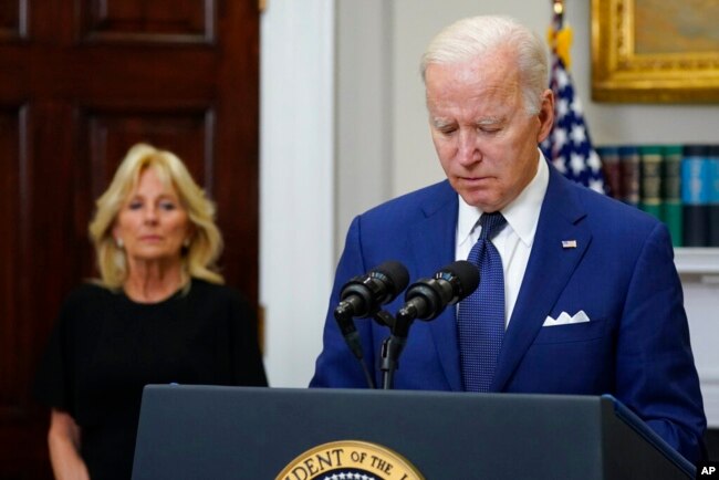 President Joe Biden pauses as he speaks about the mass shooting at Robb Elementary School in Uvalde, Texas, from the Roosevelt Room at the White House, in Washington, Tuesday, May 24, 2022, as first lady Jill Biden listens. (AP Photo/Manuel Balce Ceneta)