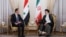 A handout picture provided by the Iranian presidency on May 08, 2022 shows Iranian President Ebrahim Raisi (R) receiving Syrian President Bashar al-Assad in the capital Tehran. (Photo by Iranian Presidency/AFP)