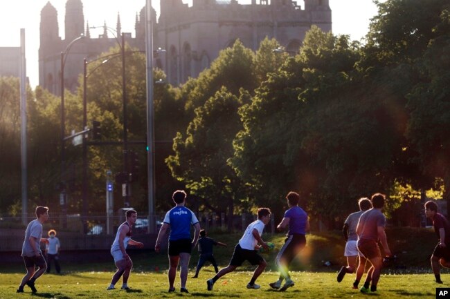 University of Chicago men's rugby team players practice near the campus in Chicago, May 6, 2021. (AP Photo/Shafkat Anowar, File)