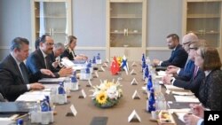 FILE - Delegations from Turkey, left, and Sweden confer in Ankara, Turkey, May 25, 2022. Senior officials from the two nations met to try to overcome Turkey's objections to Sweden's and Finland's bids to join NATO.