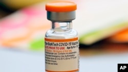 FILE - A vial of the Pfizer-BioNTech COVID-19 vaccine for children 5 to 12 years old sits ready for use at a vaccination site in Fort Worth, Texas, Nov. 11, 2021.