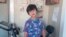 Foto Uziyah Garcia ke granpe li Manny Renfro pran nan mwad Mas 2022 pandan vakans Pak la. Timoun sa a pami viktim fiziyad la nan lekol Robb Elementary School, 24 Me a nan Uvalde, Texas. 