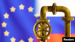 A model of the natural gas pipeline is seen in front of displayed word EU and Russia flag colours in this illustration taken March 8, 2022. 