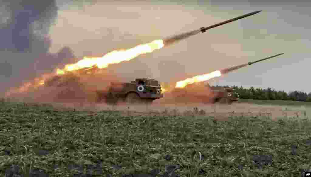 In this handout photo released by Russian Defense Ministry Press Service released, the Russian military&#39;s Uragan multiple rocket launchers fire rockets at Ukrainian troops at an undisclosed location.