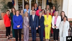 Australian Prime Minister Anthony Albanese, front center, poses with a group of women including 13 female government ministers after their swearing-in ceremony at Government House in Canberra, June 1, 2022.