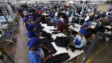 FILE - Workers tend to their jobs in a garment factory in Maseru, Lesotho, Feb. 24, 2022. The coronavirus pandemic impacted the global fashion industry and the tens of millions of workers, most of them women, who stitched the world's clothes. 