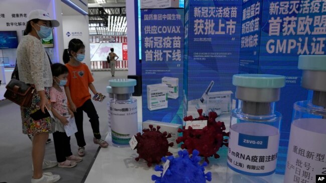 More than two years into the pandemic, China has not approved the more effective mRNA vaccines, instead choosing to pursue its own route on COVID-19 vaccines. (AP Photo/Ng Han Guan)