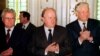 Ukrainian president Leonid Kravchuk (L), Belarus' Supreme Soviet Chairman Stanislav Shushkevich (C) and Russian President Boris Yeltsin (R), applaud after signing a document which in effect dissolved the Soviet Union, Dec. 8, 1991.