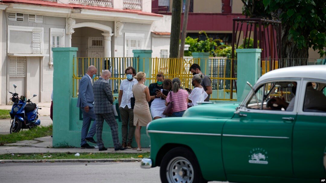 Diplomats from several countries wait outside the court building where a trial is going on for Cuban artists Luis Manuel Otero Alcantara and Maykel Castillo in Havana, Cuba, May 30, 2022.