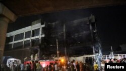 At least 26 people died after a fire broke out in commercial building near New Delhi